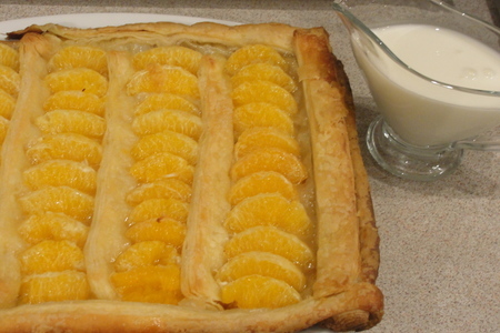 Фото к рецепту: Пирог с мандаринами и кремом сабайон