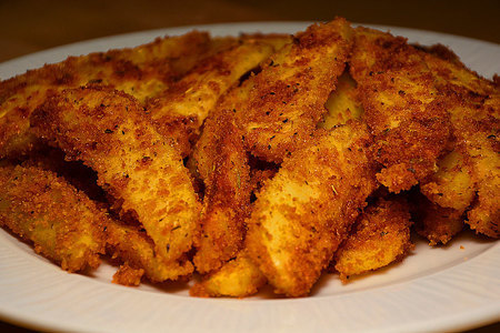 Фото к рецепту: Картофель с корочкой, запеченный в духовке (в сухарях)