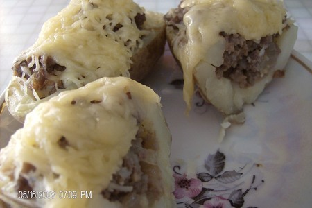 Фото к рецепту: Фаршированные картофельные лодочки