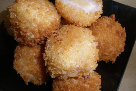Фото к рецепту: Золотые шарики с сыром