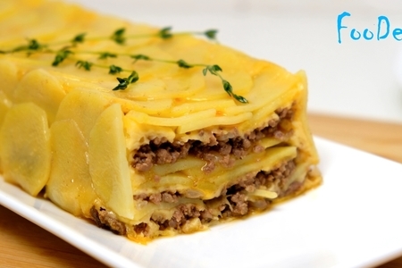 Фото к рецепту: Картофельная запеканка с фаршем и сыром