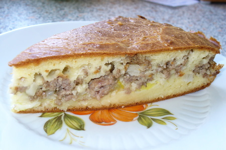 Фото к рецепту: Очень нежный мясной пирог с кабачком (быстрого приготовления)